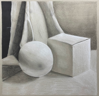 still life of ball and block drawn with charcoal